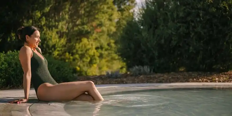 Woman relaxing at hot springs pool