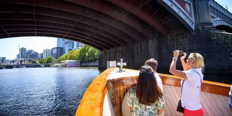 People under bridge on Yarra River cruise