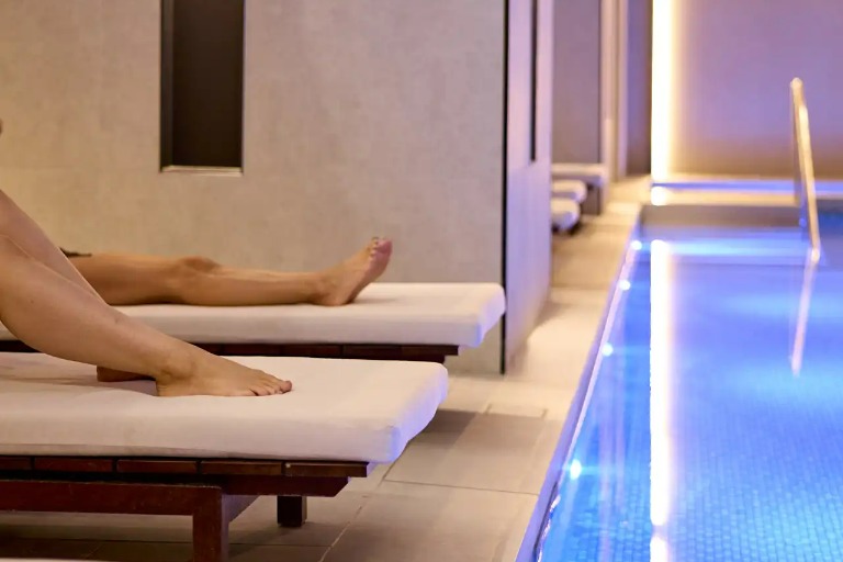 Two People relaxing by the Dorsett Melbourne pool