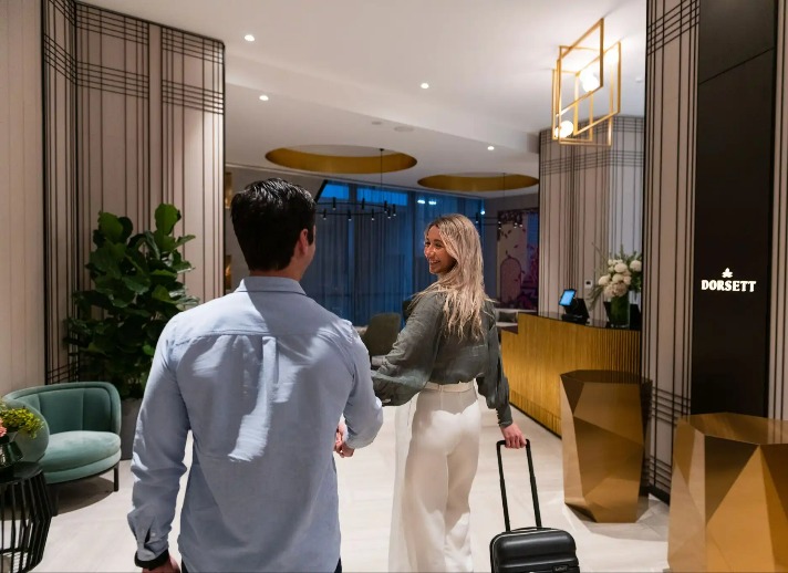 Couple walking through the Dorsett Melbourne lobby