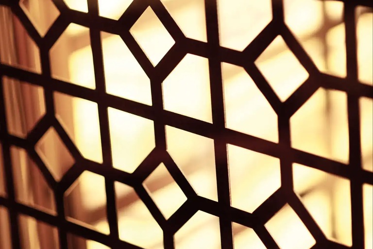 Close-up of a decorative wall with geometric patterns.