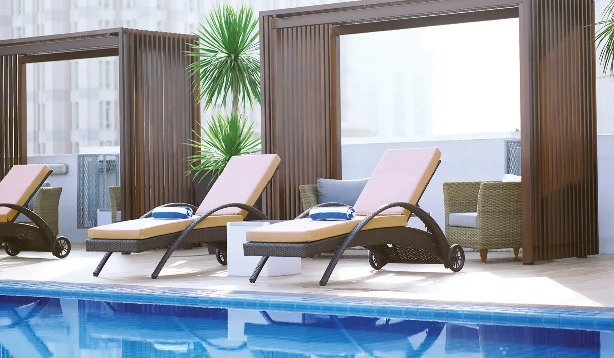 Sunloungers by the pool at Dorsett Putrajaya Hotel.