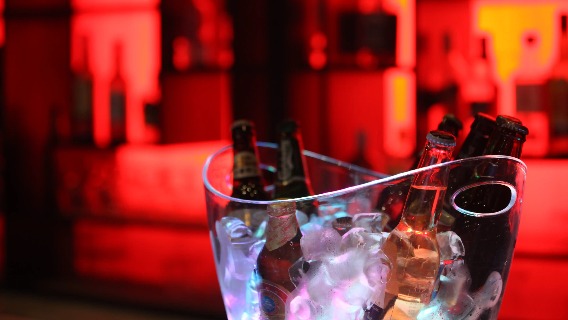 Beer bottles in an ice bowl.