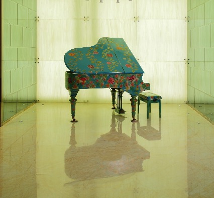 Floral-themed grand piano.