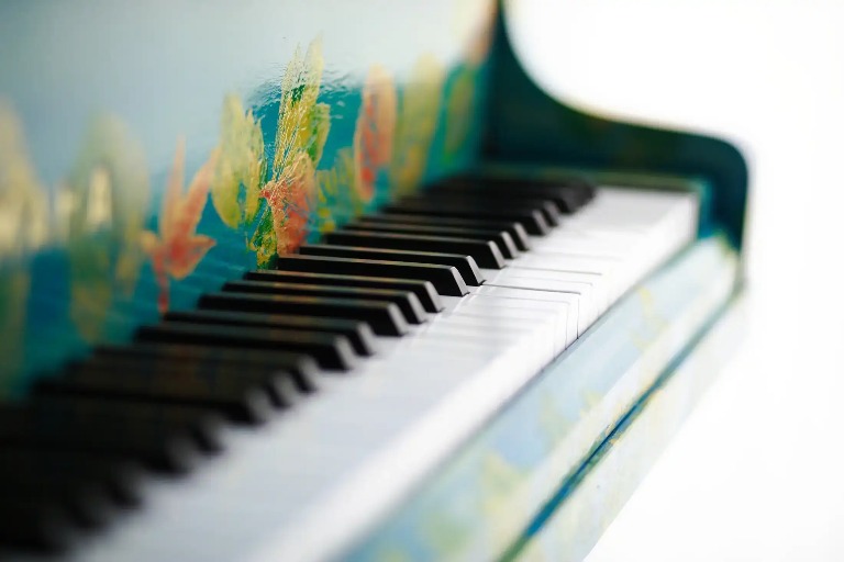 Floral -themed grand piano.