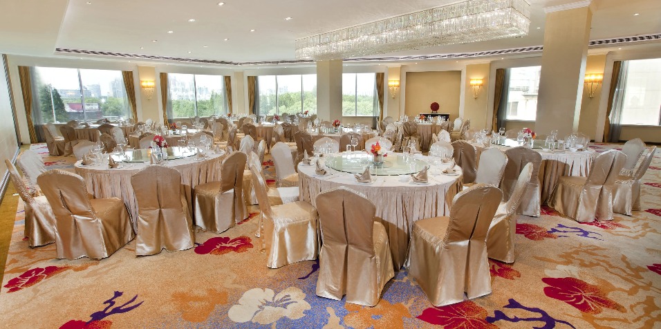 Banquet seating with light-themed decorations.