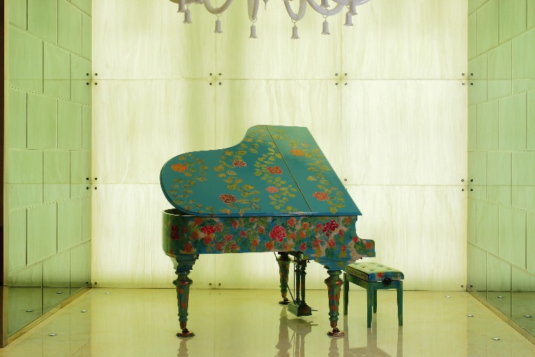 Floral-themed grand piano.