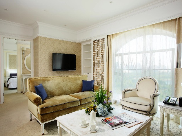 Settee, table and TV in the Dorsett Shanghai Grand Executive Suite.