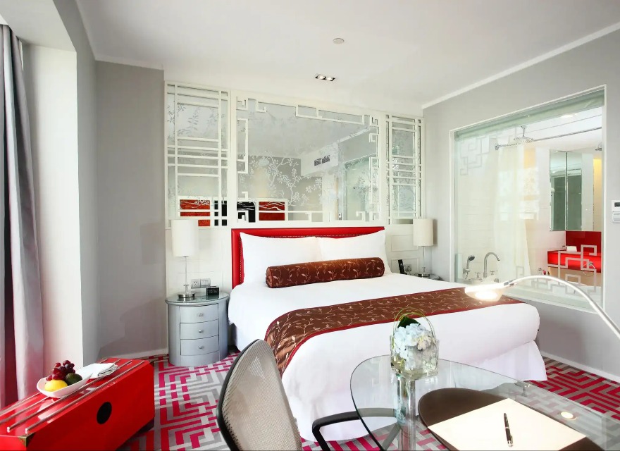 A red-themed Dorsett Shanghai Deluxe City View Room.