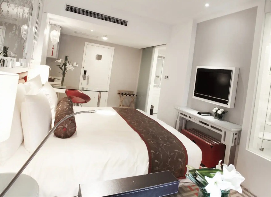 Bed, TV and work desk Dorsett Shanghai Deluxe Studio Room.