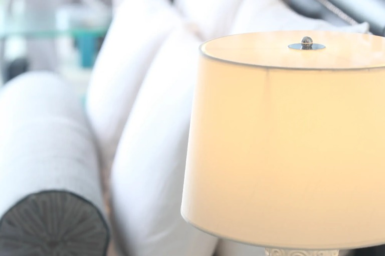 Lamp beside the bed in a Dorsett Shanghai Hotel bedroom.