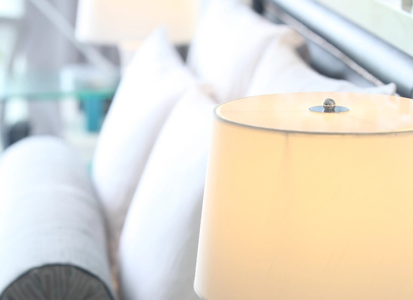 Lamp beside the bed in a Dorsett Shanghai Hotel bedroom.