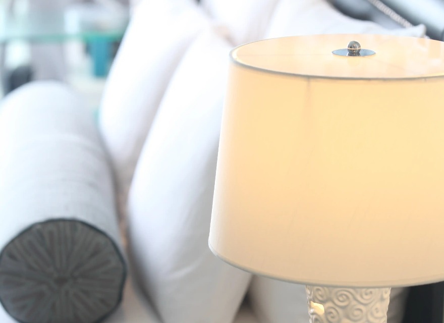 Lamp beside the bed in a Dorsett Shanghai Hotel bedroom.