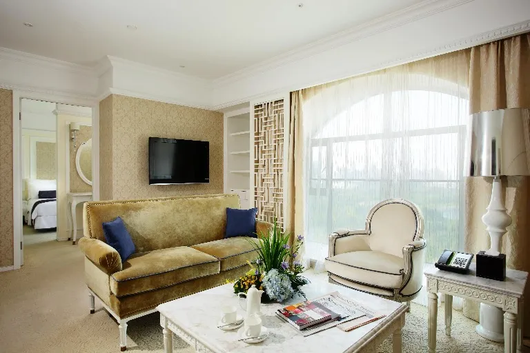 Settee, table and TV in the Dorsett Shanghai Grand Executive Suite.