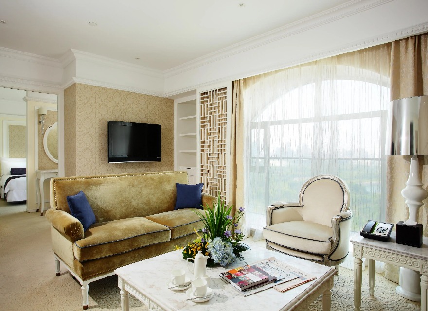 Settee, table and TV in the Dorsett Shanghai Grand Executive Suite.