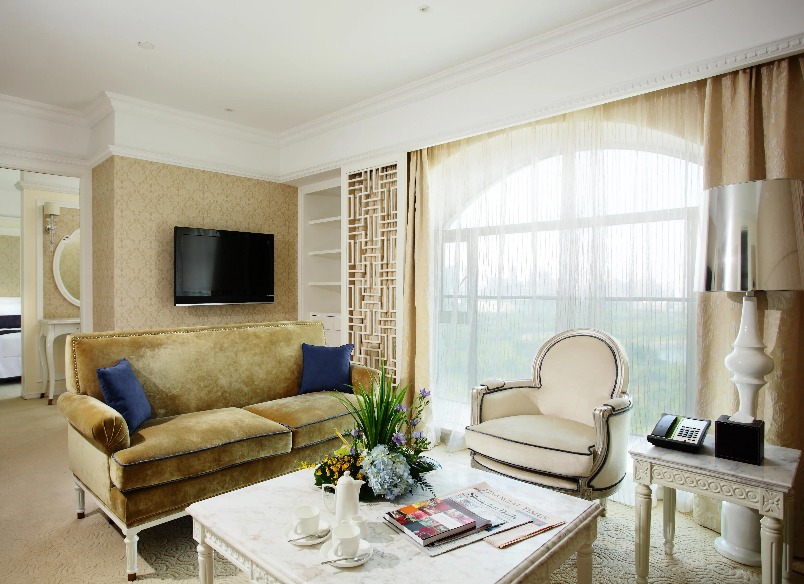 Settee, table and TV in the Dorsett Shanghai Grand Executive Suite.