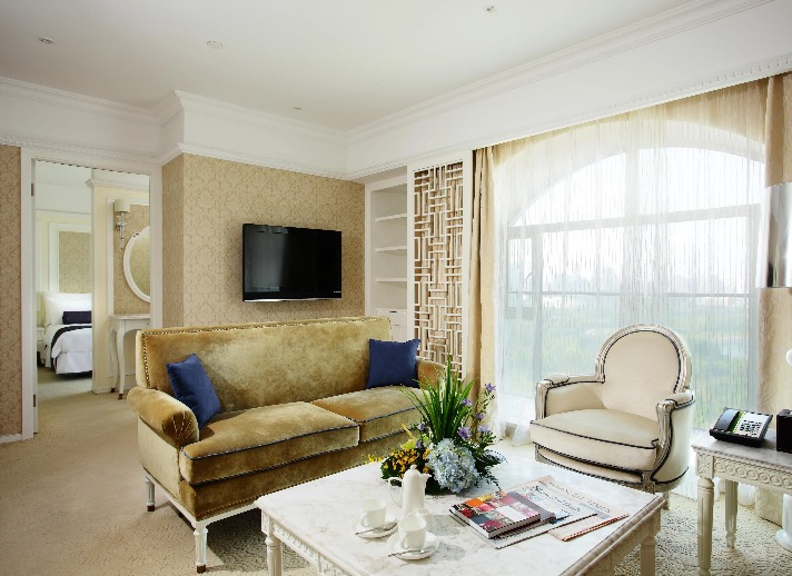 Settee, table and TV in the Dorsett Shanghai Grand Executive Suite.