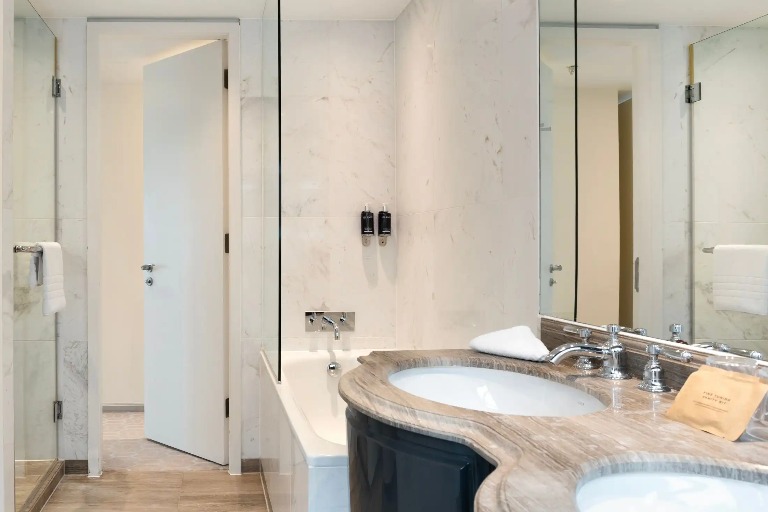 Bathtub, shower and vanity in the Suite Bathroom.