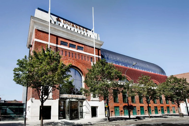 Exterior of Dorsett Shepherds Bush London Hotel during the day.