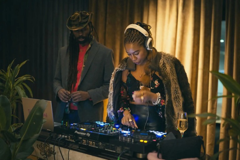 A woman performing DJ at Dorsett Shepherds Bush London Hotel.