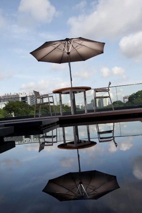 Outdoor Parasol by the pond at Dorsett Singapore Hotel.