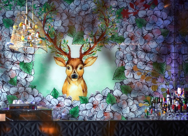 Interior of the 3T Bar at Dorsett Wanchai with a floral mural of deer