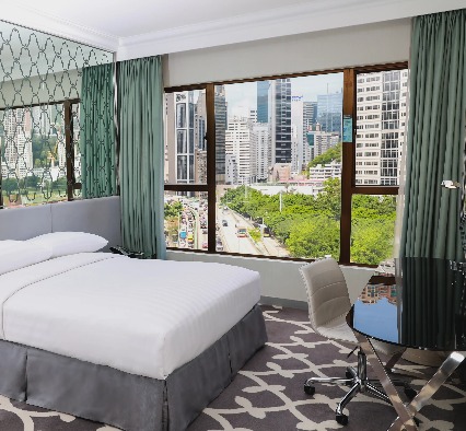 Queen size bed in Premier Causeway Bay City View Room at Dorsett Wanchai