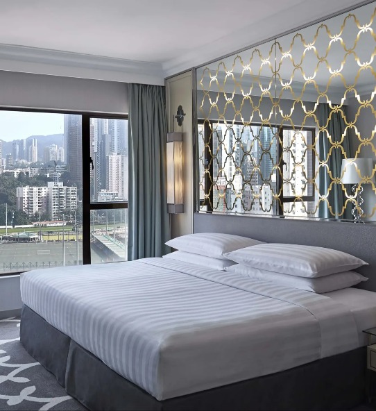 King-size bed in the Premier Course View Room at Dorsett Wanchai