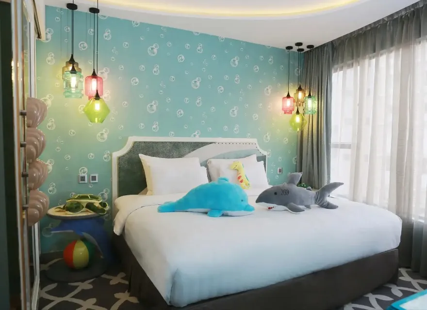 King size bed in the Ocean Suite with Dolphin Toys at Dorsett Wanchai