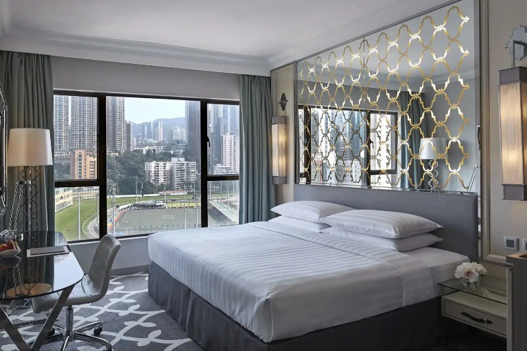 King-size bed in the Premier Course View Room at Dorsett Wanchai