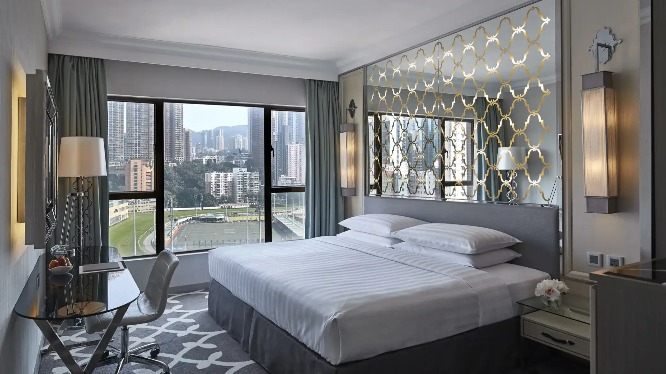 King-size bed in the Premier Course View Room at Dorsett Wanchai