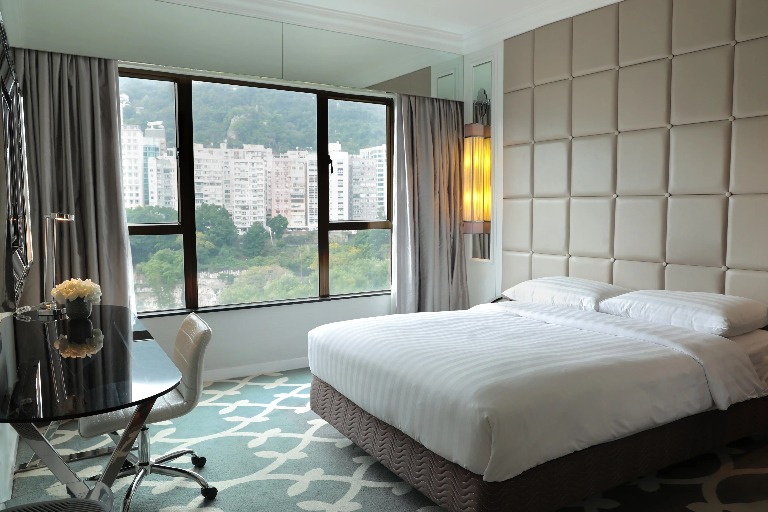 King size bed in the Superior Room with Clear Window at Dorsett Wanchai