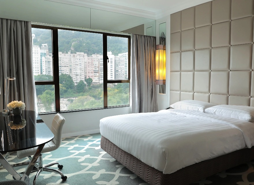 King size bed in the Superior Room with Clear Window at Dorsett Wanchai