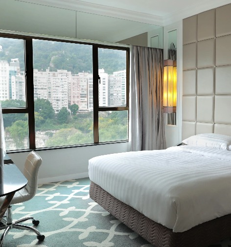 King size bed in the Superior Room with Clear Window at Dorsett Wanchai