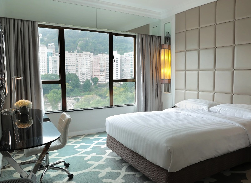 King size bed in the Superior Room with Clear Window at Dorsett Wanchai