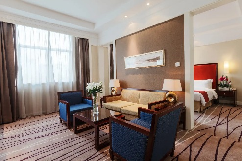 Sofa and coffee table next to the bedroom in the Lushan Resort Suite.