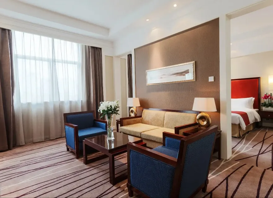 Sofa and coffee table next to the bedroom in the Lushan Resort Suite.