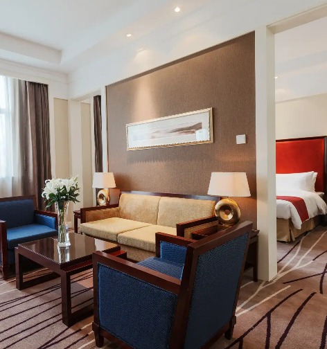 Sofa and coffee table next to the bedroom in the Lushan Resort Suite.