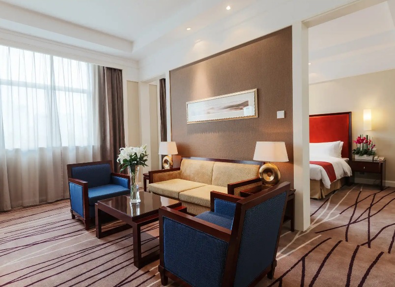 Sofa and coffee table next to the bedroom in the Lushan Resort Suite.