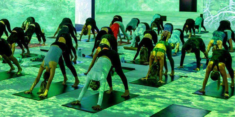 A pilates class at The Lume Melbourne with green lighting